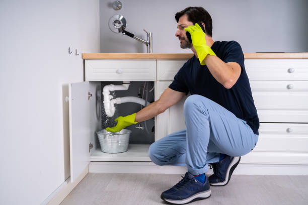 istock Sad Young Man Calling Plumber In Front Of Water Leaking 1409042409