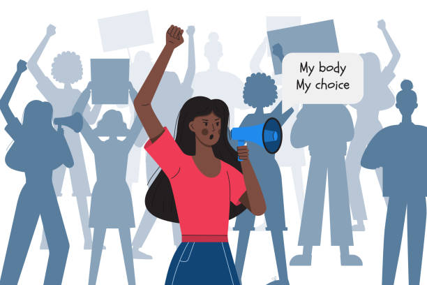 A dark-skinned girl with a clenched fist holds a megaphone against the silhouettes of protesting women. My body my choice. Protest against abortion ban. Fighting for women's rights.Vector illustration A dark-skinned girl with a clenched fist holds a megaphone against the silhouettes of protesting women. My body my choice. Protest against abortion ban. Fighting for women's rights.Vector illustration reproductive rights stock illustrations
