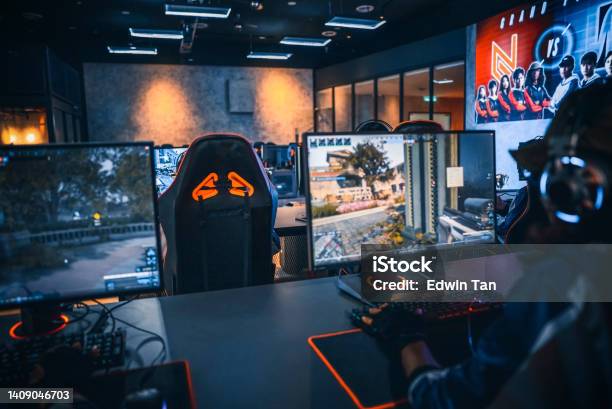 Rear View Asian Chinese Esports Team Gamer Focus Playing Rpg First Shooter Game In Grand Final Sport Event Championship Arena Cyber Games Tournament Event Stock Photo - Download Image Now