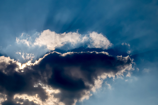 The sun rays making their way through the cloud