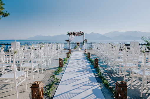 organization of wedding ceremony with sunset and sea view