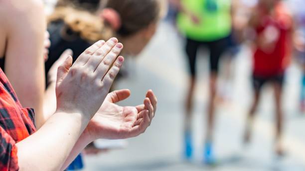 istock Unrecognizable person applauding in a long-distance race. 1409053485