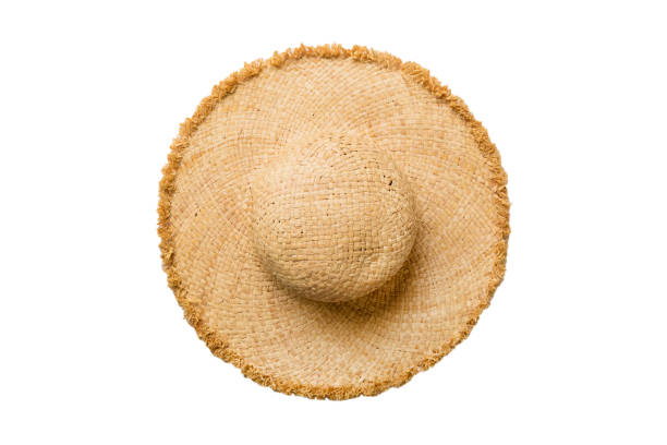 istock Womens summer yellow straw hat top view, isolated on white background 1409055034