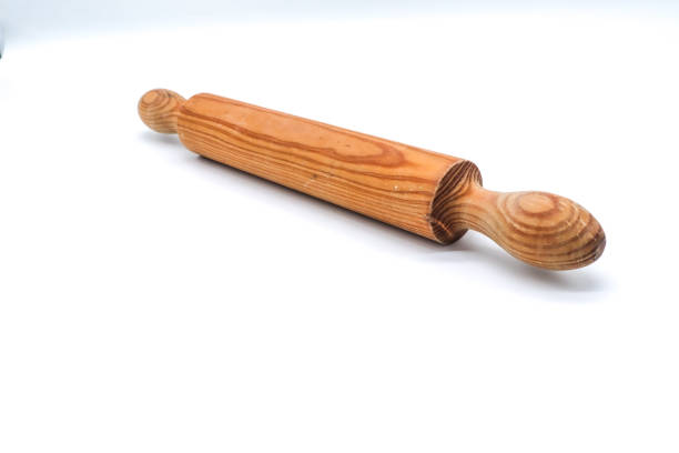 istock wooden rolling pin on white background 1409059465