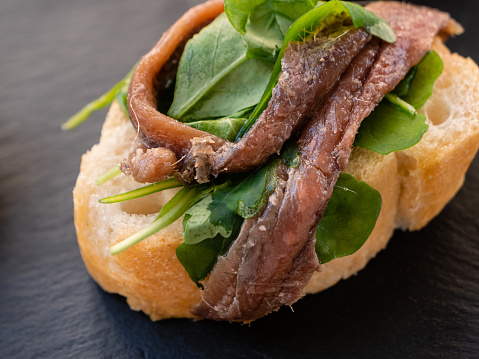 Cicchetto with White Bread, Anchovy and Spinach Leaves