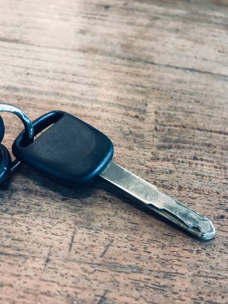 istock Car keychain on the wooden table 1409065108