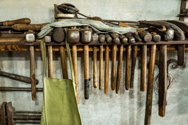 istock lots of hammers of different sizes hanging on shelf in carpentry workshop 1409070394