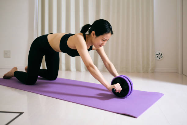 istock Woman training abdominal muscle 1409075057