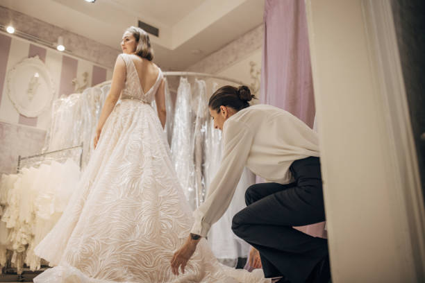 istock Woman trying on a wedding dress 1409082342