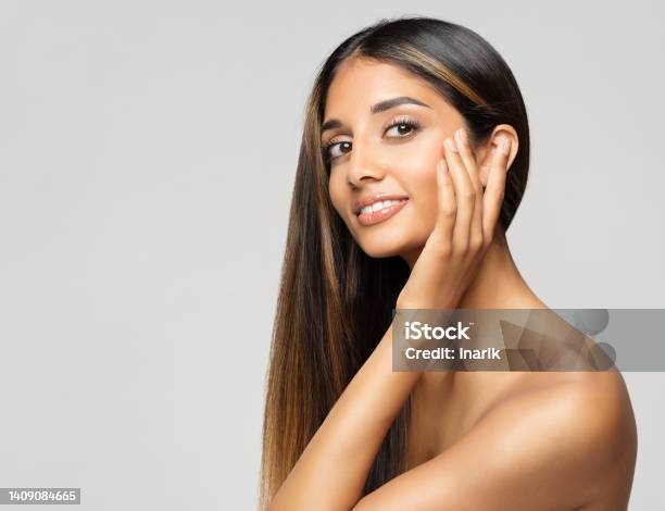 Young Woman Face Portrait Beauty Model Touching Cheekbones Women Facial Skin Care And Facelift Treatment Over White Background Smiling Fashion Girl With Smooth Makeup Stock Photo - Download Image Now