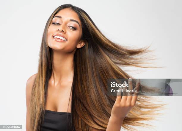 Brown Hair Beauty Woman Brunette Model With Shiny Straight Long Hairstyle Hair Care Spa And Keratin Straightening Over White Cheerful Smiling Girl Touching Flying Healthy Smooth Hair Stock Photo - Download Image Now