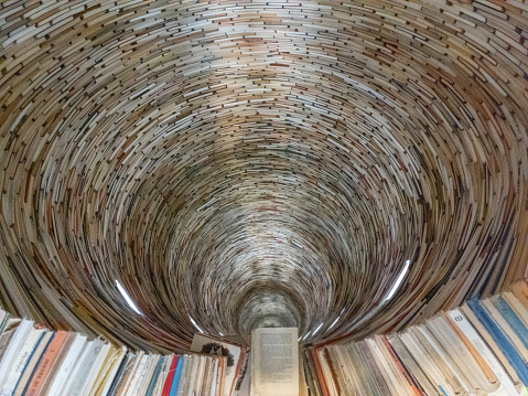 The perspective of a tower of books stacked. the infinity