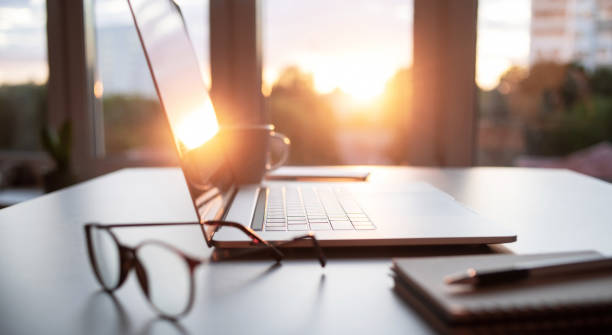 istock Place of work. Laptop on a table at home office 1409087105
