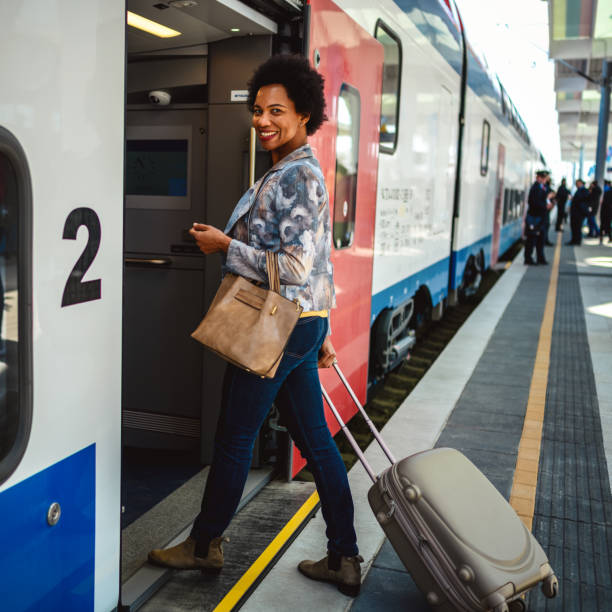 istock African-American woman entering train 1409087111