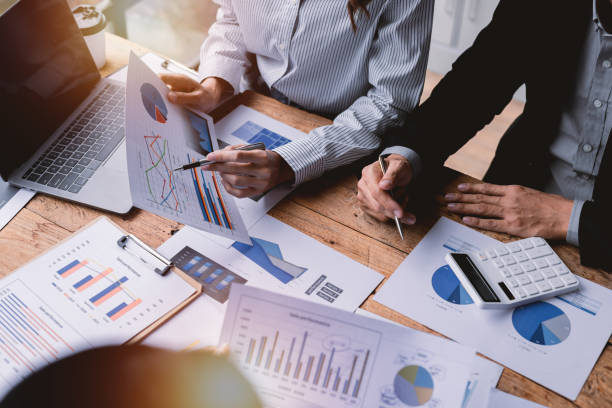 istock Team Of Business working at office with documents on his desk, doing planning analyzing the financial report, business plan investment, finance analysis concept 1409088031