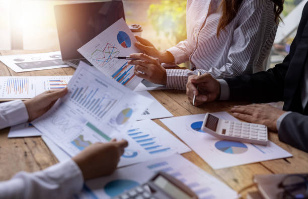 istock Team Of Business working at office with documents on his desk, doing planning analyzing the financial report, business plan investment, finance analysis concept 1409088039