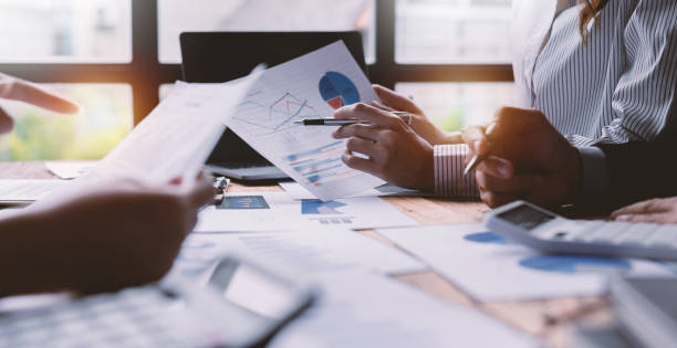 istock Team Of Business working at office with documents on his desk, doing planning analyzing the financial report, business plan investment, finance analysis concept 1409088050