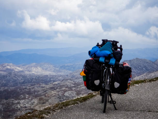 istock Loaded touring bicycle with mountains in the background 1409092730