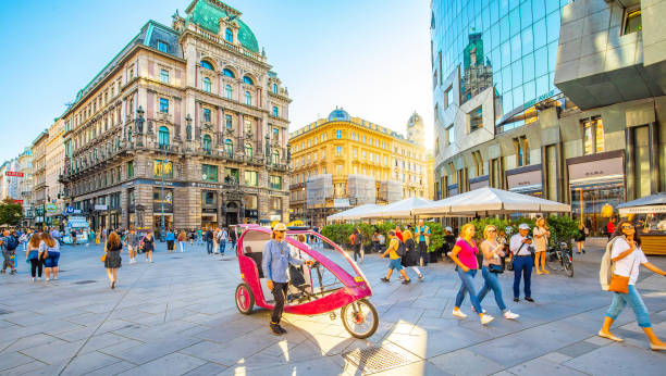 Graben street view and Vienna city skyline, Austria Vienna, Austria - 12 May, 2022: City skyline and Graben street scenic view, people walking on a street people shopping in graben street vienna austria stock pictures, royalty-free photos & images