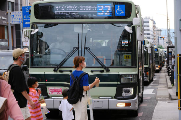 A line of buses wait through a traffic jam during the Gion Festival stock photo