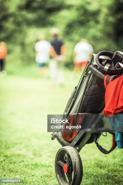 Golfing Partners Playing Golf Stock Photo - Download Image Now - Active Lifestyle, Adult, Adults Only