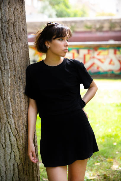 istock Young woman wearing black t-shirt 1409108656