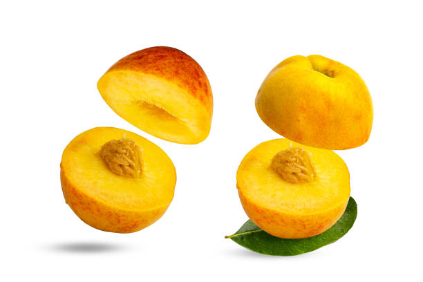 istock Peach isolated. Peach slices. Peach with leaf on white background 1409108823