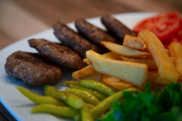istock Grilled Meatballs and fired potatoes 1409109264