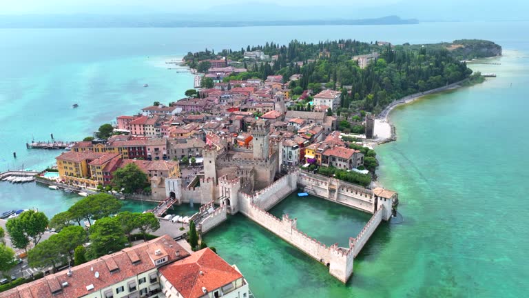 Aerial view with a drone of Scaligero Castle (Sirmione), Built in the latter half of the 14th Century on the southernmost part of Lake Garda in Northern Italy