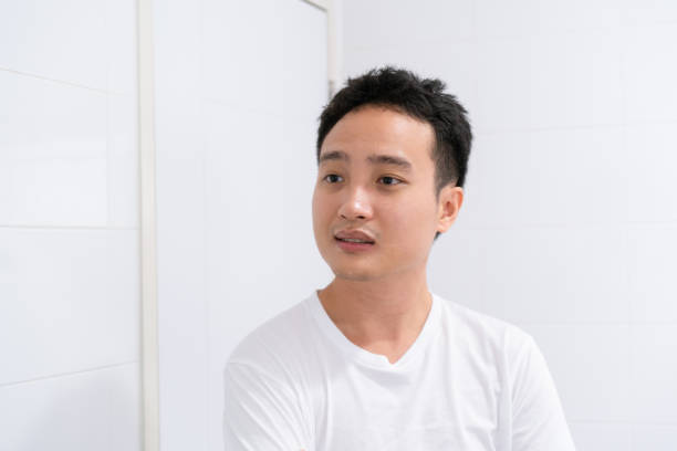 istock Man looking himself in the mirror. 1409111051