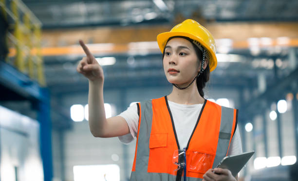 istock High-tech factory women hand click virtual screen 1409113248