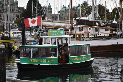 Victory Island Harbour In Vancouver British Columbia Canada, Victoria Harbour Tour Boat, Legislative Assembly Of British Columbia, Tour Boat, Water, People, Canada Flag, Sky Scene During Autumn Season