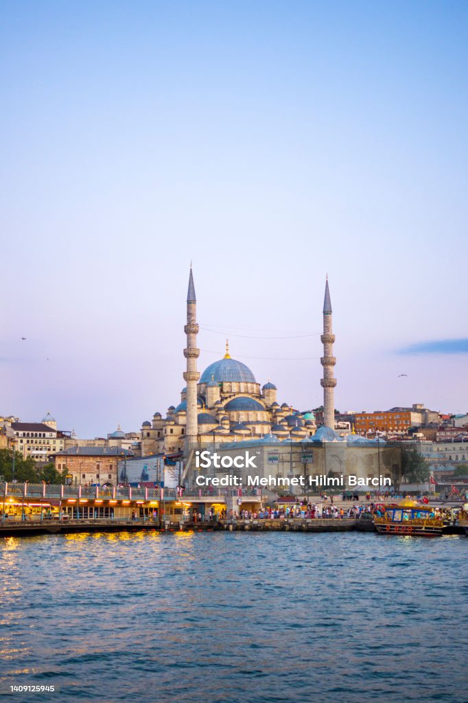 Yeni Cami Mosque and Galata Bridge at sunset, Istanbul, Turkey Bosphorus Stock Photo