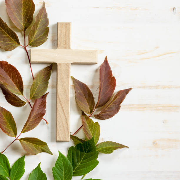 istock Christian cross and autumn leaves 1409131017