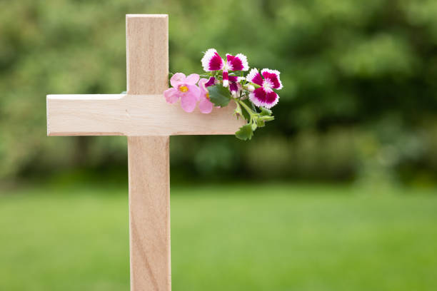 Cemetery vase or memorial vase arrangement with Pink and Purple flowers, is designed to hold flowers at a graveside.