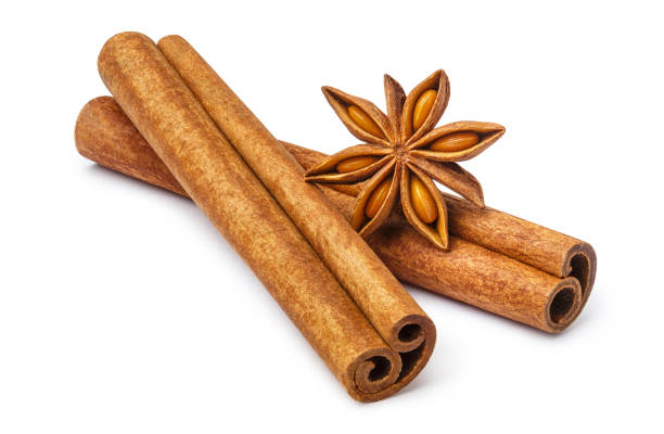 istock Delicious cinnamon sticks and star anise on white 1409131243