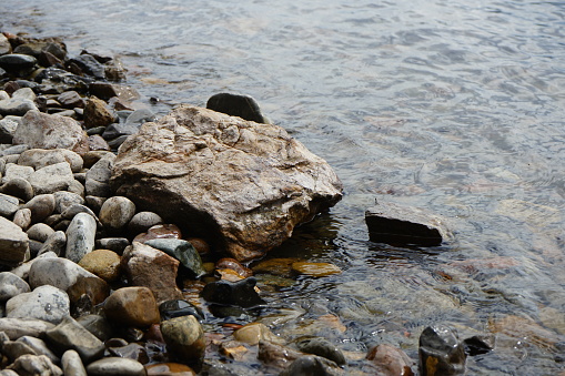 Rocky coast. Stones in the water. Close-up.