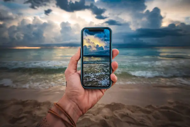 Tropical beach picture on smartphone - travel concept - travel blog