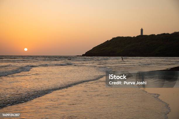 Lighthouse And Sunset At Achara Beach Sindhudurga Maharashtra Stock Photo - Download Image Now