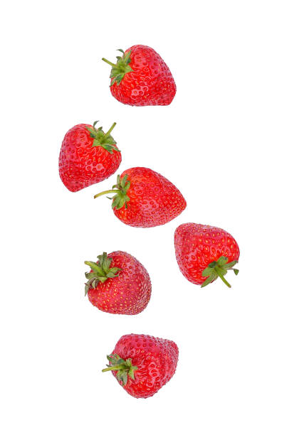 istock Strawberry falling in the air isolated on white 1409135835
