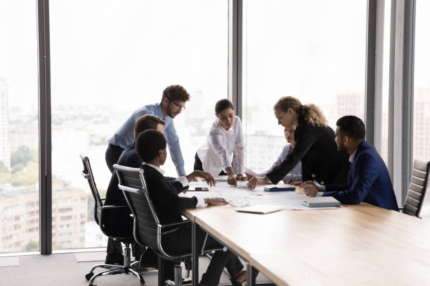 istock In modern boardroom diverse employees develop marketing strategy, analyze papers 1409136756