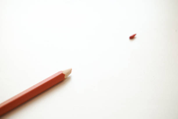 istock Red pencil on a white background. Broken pencils tip, chancellery, school supplies 1409138200