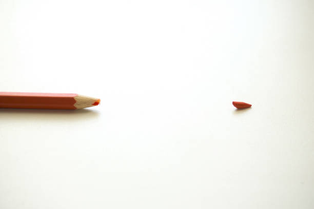 istock Red pencil on a white background. Broken pencils tip, chancellery, school supplies 1409138215