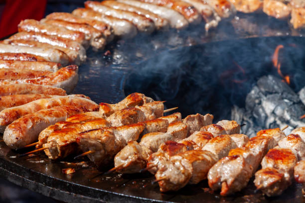 istock Assorted delicious grilled meat and bratwurst over the coals on a barbecue. Selective focus. 1409139478