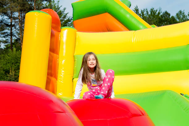 istock Girl Resting on Inflate Castle 1409143092