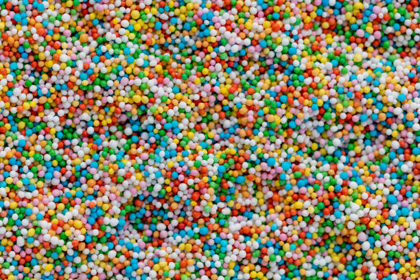 istock Thousands sprinkles tiny sugar beads for decorating cakes and desserts background. 1409146194