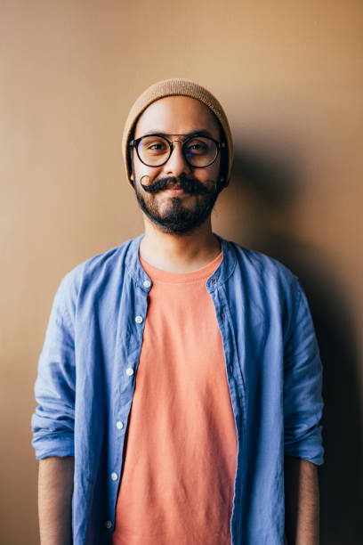 istock A Happy Influencer With Glasses And A Beanie Looking At Camera 1409150743