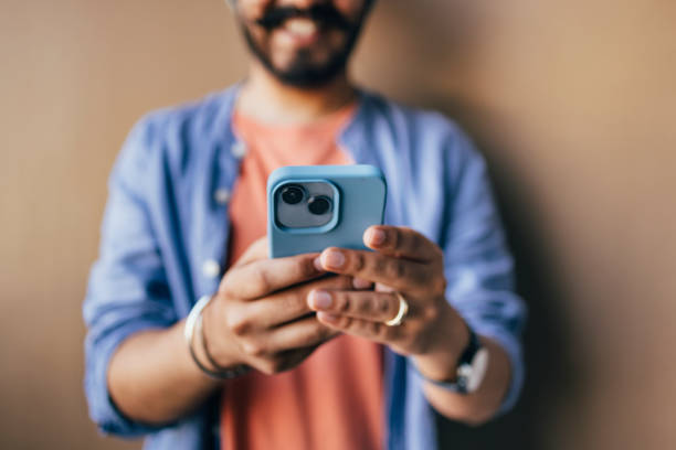 istock An Unrecognizable Happy Casually Dressed Influencer Texting On His Mobile Phone 1409150744