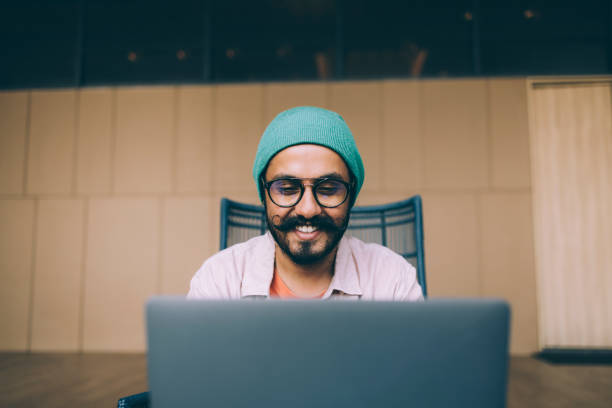 istock A Happy Bearded Businessman Working On His Computer While Sitting In The Office 1409150762
