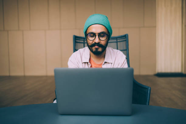 istock A Happy Bearded Businessman Working On His Computer While Sitting In The Office 1409150763